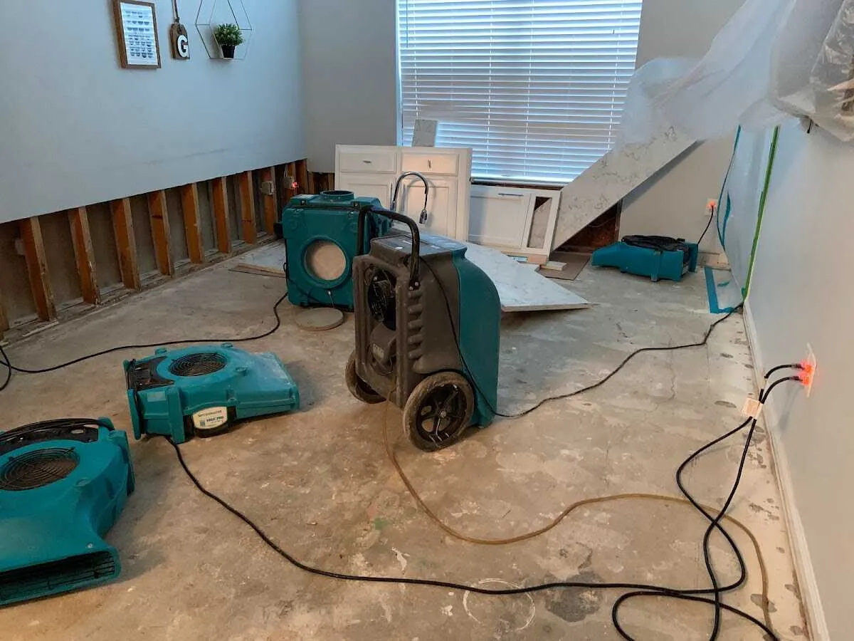 Dehumidifier in flood-cut room for Water Damage Restoration in Minot